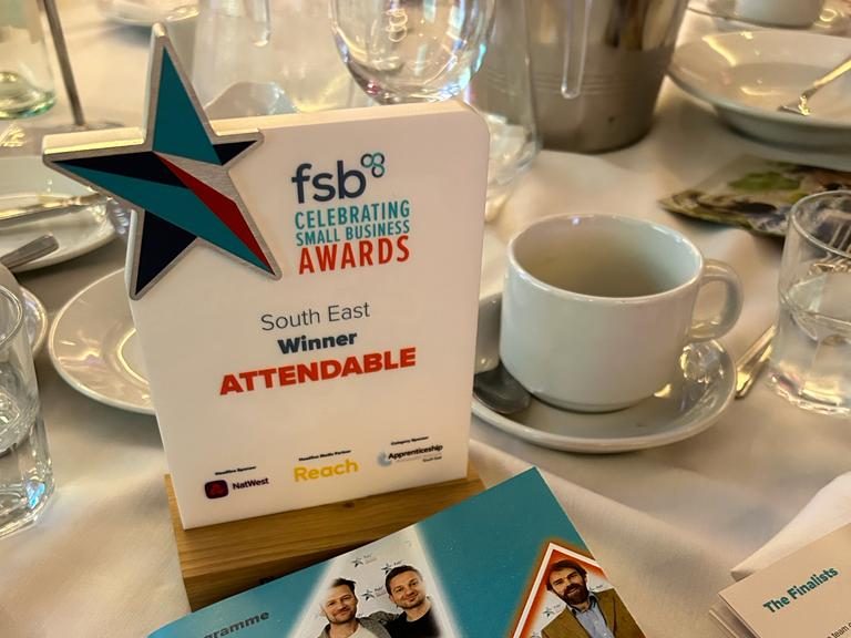 Attendable's FSB award sits on a table with a white tablecloth